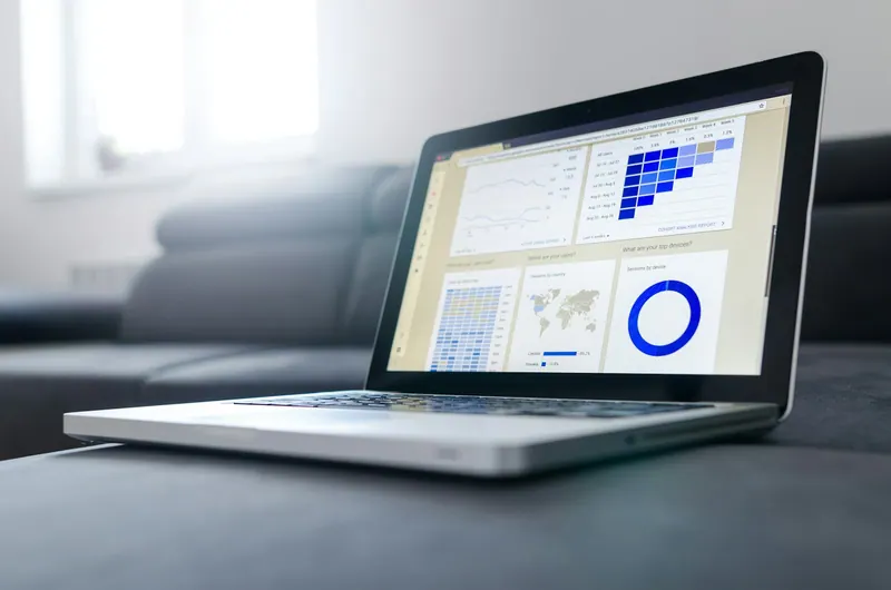 Monthly management accounts dashboard open on a laptop