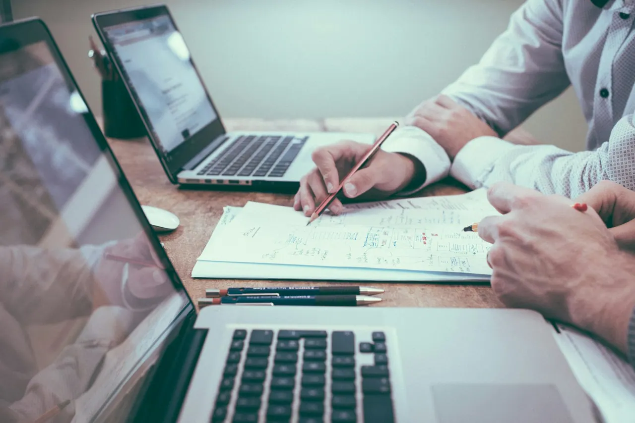 Accountants reviewing financial figures together in a modern office